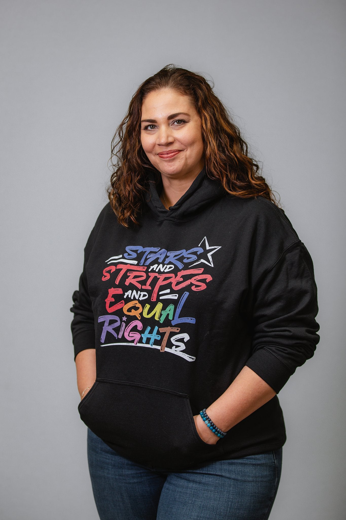 Stars and Stripes and Equal Rights (Rainbow Letters) - Unisex Hoodie in Dark Colors - Supporting Equal Rights for All Americans Shirts & Tops Woke American Apparel